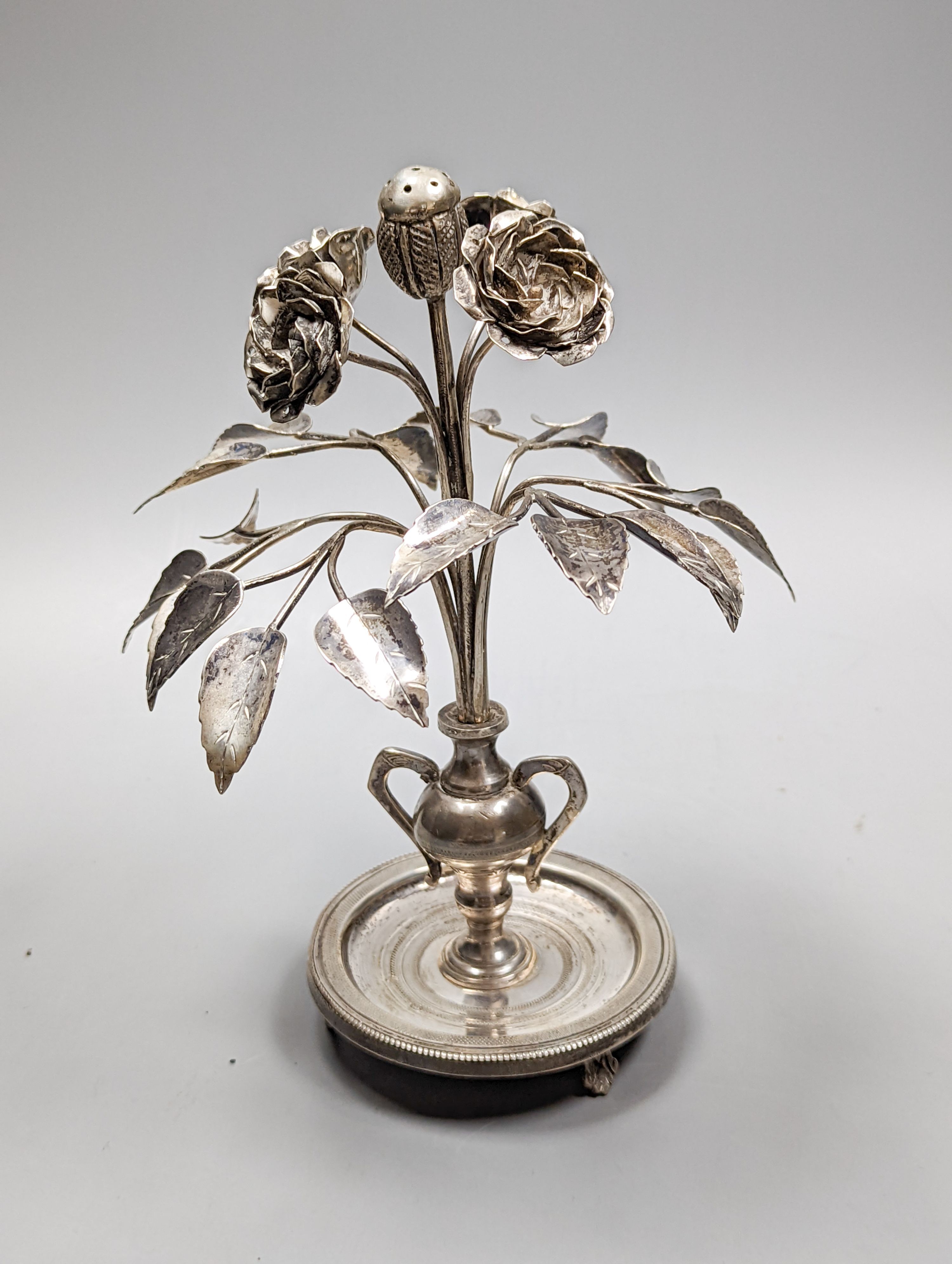 Tw South American? white metal toothpick holders?, modelled as a floral displays with circular bases, one with birds